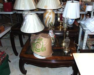 Modern glass top coffee table, end table and lamps (items sold separately).