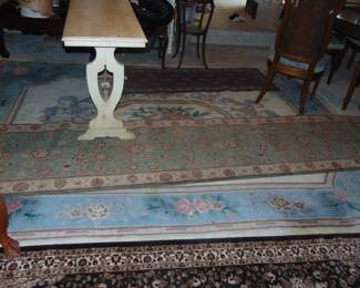 Oriental rugs and runners, and hall table (items sold separately).
