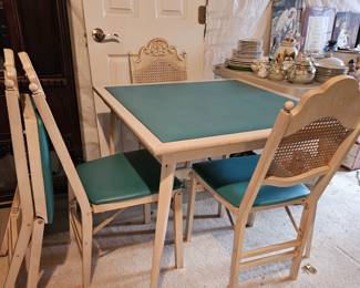 Vinyl top square table and set of 4 folding chairs.
