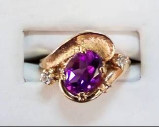Amethyst in a yellow gold setting with diamonds 