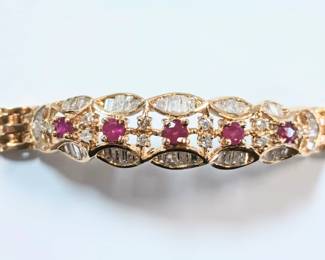 Beautifully designed 14k bracelet with Rubies and Baguettes
