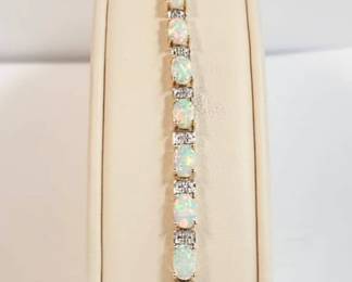 Syn. Opal and diamond bracelet in yellow gold 