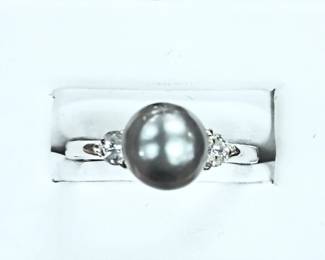 Tahitian pearl ring in white gold setting. diamond accents 
