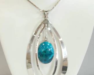 Hand made sterling 3" long pendant with Chrysocolla Stone. Chain 29"