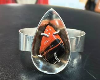 Vintage modern cuff with cool orange and black stone. 
Small wrist