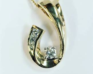 Diamond pendant with 0.13 ct tw in 14k 
18" chain