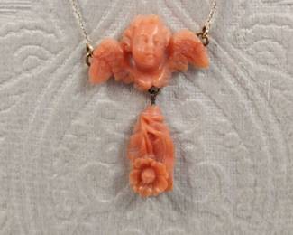 Victorian coral angel on a yellow gold chain 