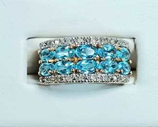 Blue topaz ring with diamonds in yellow gold
