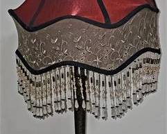 Lot 005   3 Bid(s)
Boutique Lamp with Fringed Shade marked Dale Tiffany