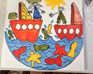 Pottery tile with stick figure and fish design 7"