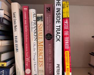 Group of books including Small Miracles