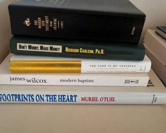 Group of books including Don't Worry, Make Money