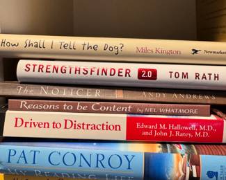 Group of books including Driven to Distraction