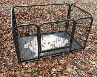 Dog enclosure is 49" x 32" x 27.5".