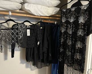 Numerous shawls, shrugs, throws, and small cardigans to wear over your finest to take the chill off, several of which are brand new.