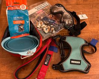 Variety of cat and dog equipment, toys and accessories.