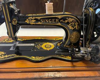 One of many antique sewing machines, many of which are in beautiful wood cases. Her collection is extensive.