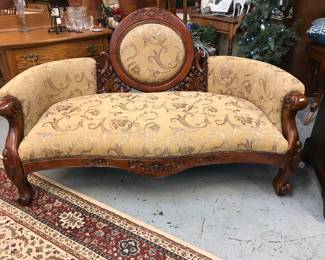1800's Style Cameo Victorian Sofa.  Gently curved arms and legs. Beautiful carving