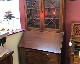 Love this China/Secretary.  Opens up to wonderful cubbies and secrete compartments.  Bow Front- Maddox