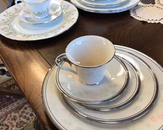 These are individual China Display Sets from Dillards.  A buyer would choose the pattern they would like to purchase and Dillards would bring out number of place settings purchaser was purchasing.  These settings are perfect to complete or add to your set.