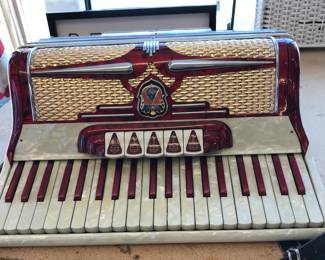 Cardinal Red Accordion with case...made in Italy. Beautiful.  We have not played this accordion since we received it.