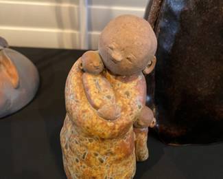 Tiny clay mother and baby