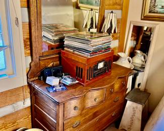 Antique oak chest with mirror,  3 in 1 turn table, radio, and cd player, and old 33rpm albums