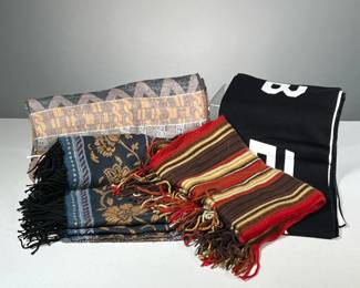 (4PC) MIXED GROUP OF SCARVES | Includes: black and white Bebe Sports scarf, dark colored Simon Chang scarf, colorful scarf from V. Fraas, and striped warm colored scarf from Echo soft.
