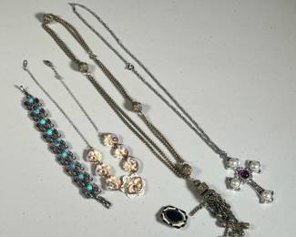 (5PC) VINTAGE COSTUME JEWELRY | Including a turquoise and silver-style feather-form bracelet (l. 6.75 in.), a shell necklace, a necklace with large cross-form pendant, a brass-tone tassel necklace, and an enamel pin. 

