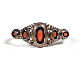 NAVAJO CORAL & STERLING BRACELET | Oval coral cabochons "shadowbox" set in a sterling cuff bracelet signed "NC"; 0.66 ozt. - w. 2.25 in

