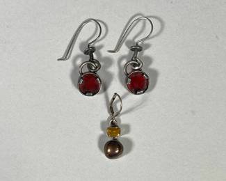 (3PC) STERLING EARRINGS | Including pair of Sterling earrings with round amber centerpiece and other Sterling earrings, all stamped “925” on the back. 

