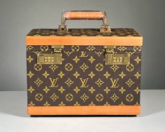 "LV" PRINT TRAVEL CASE | Locking hard shell travel case with brown leatherette LV print and Cagiva Italy hardware, retains original paperwork to set the lock combination. - l. 11.5 x w. 6.75 x h. 8.5 in
