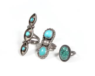 (3PC) NAVAJO TURQUOISE RINGS | Turquoise set in silver, including a spiderweb turquoise ring, a ring signed "DG" with two stones, and a long ring with three turquoise stones (l. 2.25 in.), all settings tested as silver; all together 0.85 ozt. 
