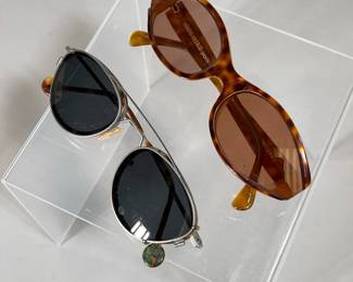 (2PC) PRESCRIPTION SUNGLASSES SET | Two pairs of prescription sunglasses: one by Alain Mikli Paris with a marbled brown frame, one by L.A Eyewear with clip-on outer sunglasses lenses and a modern wire frame with marbled brown and turquoise highlights. - l. 5.5 x w. 1.5 in
