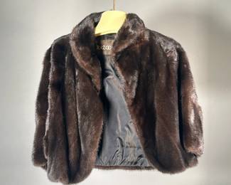 RAZOOK'S FUR SHAWL | Dark brown / black fur shawl / shoulder cover with Razook's label and in a Razook's garment bag.
