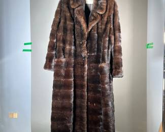ELI GURLAND FUR COAT | Women's long fur coat with pockets, silk lined interior with Eli Gurland & Sons label. - l. 50 in (from shoulder)
