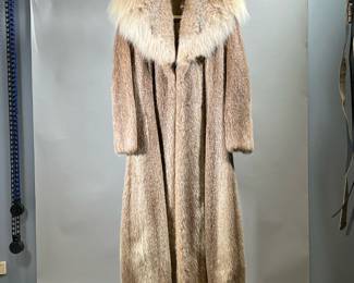 LADIES' FUR COAT | Long fur coat with oversized collar, possibly coyote fur, silk lining monogrammed, with no apparent tag/label. -  l. 47 x w. 18 in (shoulder to shoulder/hem)

