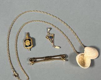 (4PC) GOLD-FILLED JEWELRY | Including a "SWANK" bar clip, a blue gemstone and pearl pendant, a 12/20 GF chain with two shell pendants, and an enameled crest jewelry element. 

