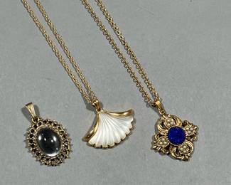 (3PC) PENDANT NECKLACES | Two gold-tone costume pendant necklaces, one by Avon with a lapis-style pendant and one with a fan-form pendant, plus a single cabochon pendant. -  l. 13.5 in (longest)

