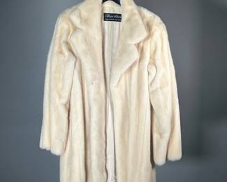REVILLON FUR COAT | Women's white fur coat with silk lining and Revillon label. 

