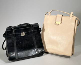 (2PC) MARK CROSS LEATHER HANDBAGS | Two leather handbags by Mark Cross New York. Black: 11 x 9.5", 3.5" base. Cream: 12 x 10", 3" base
