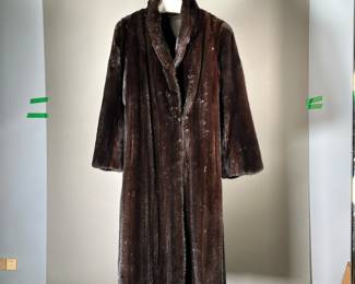 BLACK FUR COAT | Lady's long fur coat, silk lined interior embroidered "Ellen Rau" with scrollwork decoration. - l. 44 in (from shoulder)
