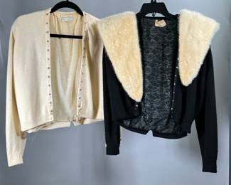 (3PC) B ALTMAN VINTAGE CASHMERE CARDIGANS WITH MINK COLLAR | Two vintage riviera cashmere cardigans for Bernard Altman with one mink collar. Cardigans are size small: one cream, one black, with lace lining, satin buttons at bottoms and cuffs, and snaps for attaching cream mink collar.
