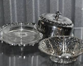A Full Image of all 3 Pieces of the Silver Plate Butter Dish, Base, Lid & Glass Insert ($30) beside a Woven Silver Plate Bowl. 