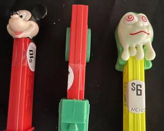 Vintage Pez Dispensers Mickey ($10) Beside Vintage Red & Green Car ($20) & Halloween Slimy Sid Face in Yellow ($6) 