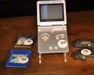 Pictured Alongside Some Available Accessories is the Nintendo Gameboy Advance SP. ($98) 