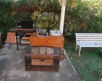 Weber grill, antique trunk, park bench, cart