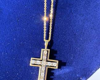 Gold and diamond Cross necklace.  About .75 carats of diamonds. 14k gold chain is approximately 19 1/2” long. 