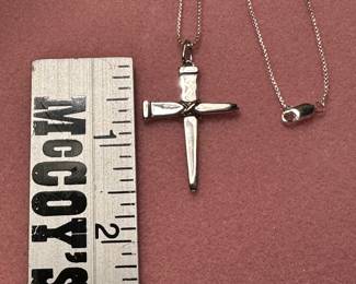 Two sterling silver nails form the cross. Sterling silver chain is approx. 22” long. Both marked .925. A beautiful reminder of He who died for us. 