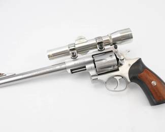 Make: Ruger
Model: SUPER REDHAWK
Caliber: .44 MAGNUM
Bore: Shiny
Serial # 550-27137
Condition: Excellent
The Super Redhawk was introduced late in 1987, in .44 Magnum with a 9.5-inch barrel. The final product used the same trigger design and same grip panels as the .357 Magnum GP100, but had a larger, stronger frame with integrated scope bases. The Super Redhawk received positive reviews, edging out similar offerings from Smith & Wesson in accuracy and price. Comes with a nikon 2x20 scope and a hard cover case. This revolver is in excellent condition showing normal signs of use and wear.